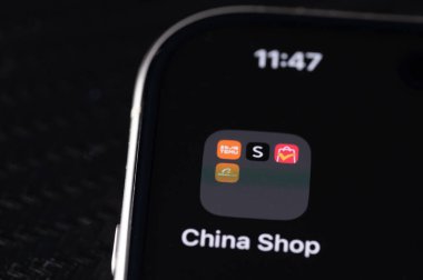 New York, USA - July 25, 2024: Buying from china online shop on iphone screen macro close up view clipart