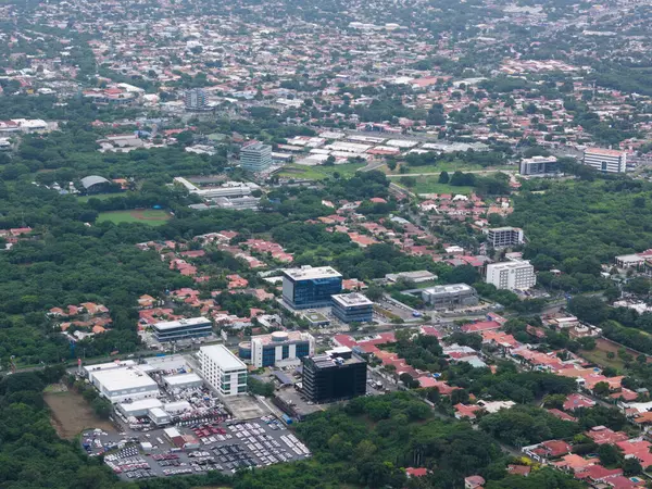 stock image Managua, Nicaragua - August 14, 2024: Office building in Managua city aerial drone view