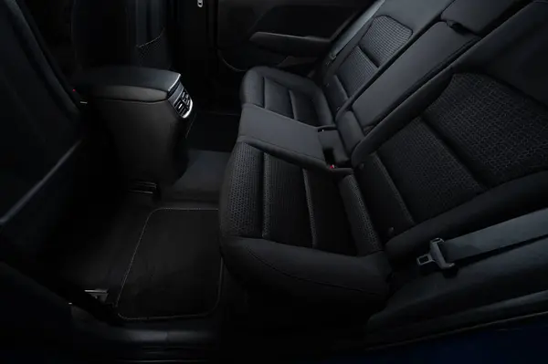 stock image Clean car interior with soft dark mats on floor and textile seats