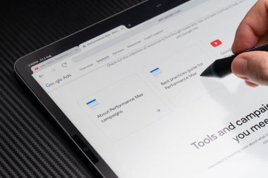 New York, USA - August 2, 2024: Google ads performance tools on tablet screen macro close up view clipart