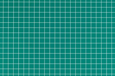 Şebeke desenli canlı yeşil el işi yüzeyi, malzemeleri kesmek ve doğrulukla tasarımlar yaratmak için ideal..