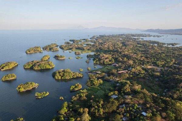 Tropical destination in Nicaragua with volcanoes background aerial view