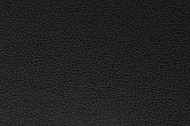 Benzersiz dokusunu ve tahıl kalıplarını gösteren siyah deri yüzeyin detaylı görüntüsü, zenginlik ve kaliteyi aktarıyor..