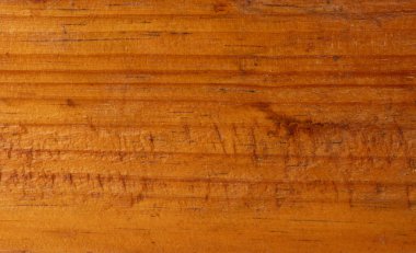 Tahta yüzeye yakın çekim yaparak sıcak tonlarını ve karmaşık tahıl şekillerini vurgulayarak doğal güzelliklerini sergiliyor..