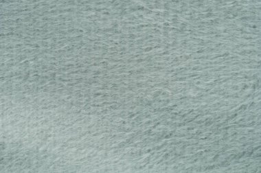 Soluk gri renkli yumuşak dokunun yakın çekim görüntüsü tasarım projeleri ve arka planlar için mükemmel..