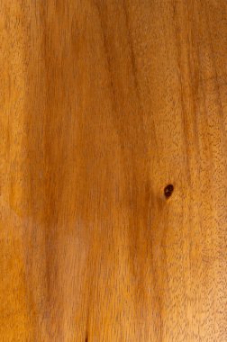 Pürüzsüz kahverengi ahşap arka plan ve siyah nokta makro yakın görünüm