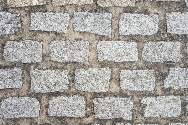 古い石畳の舗装の背景のテクスチャ クローズアップビュー — ストック写真