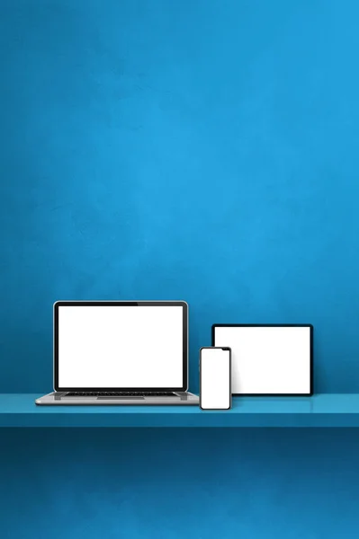 蓝墙架上的笔记本电脑 手机和数码平板电脑 垂直背景 3D说明 — 图库照片