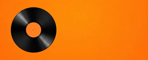 Vinyl record isolated on orange background. Horizontal banner. 3D illustration