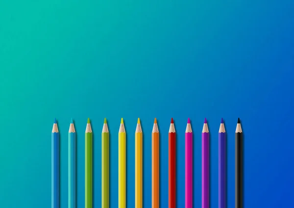 stock image Wooden colored pencil set isolated on blue. Horizontal background.