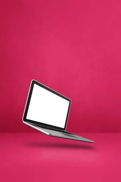 Blank computer laptop floating over a pink background. 3D isolated illustration. Vertical template