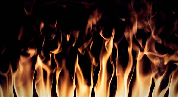 Flammen Kamin Textur Hintergrund Isoliert Auf Schwarzem Hintergrund lizenzfreie Stockfotos