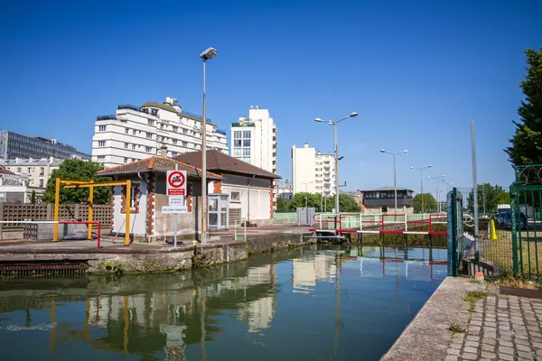 stock image Paris - France - June 05, 2023 : Lock of Canal Saint-Denis view from the banks in summer