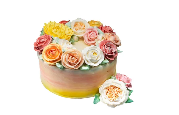 beautiful homemade cake in the form of a unicorn with cream colored flowers on white background