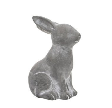Beyaz arka plandaki dekorasyon için sevimli çimento tavşan heykeli