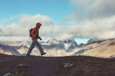 Hiker in beautiful mountains in Tombstone Territorial Park, Yukon, Canada