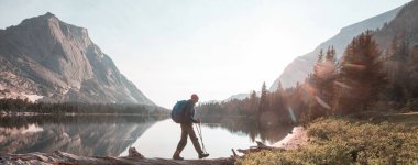 hiker in mountains on beautiful rock background