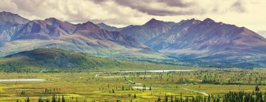 Beautiful high mountains in Alaska, United States. Amazing natural background.