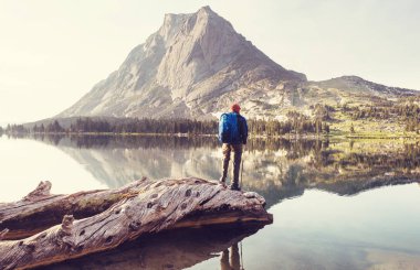 hiker in mountains on beautiful rock background
