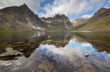 Beautiful blue lake in polar tundra along Dempster highway, Yukon, Canada