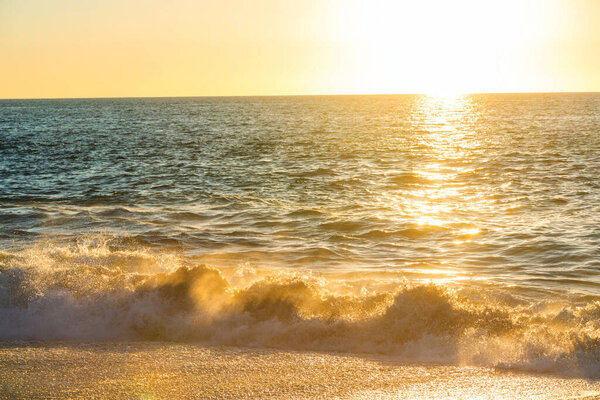 Blue wave on the beach. Dramatic natural background.
