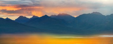 Beautiful high mountains in Alaska, United States. Amazing natural background.