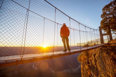 Man on the suspension bridge in Barrancas mountains, Mexico