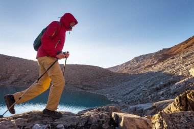 hiker in mountains on beautiful rock background