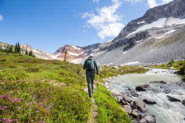 hiker in mountains on beautiful rock background