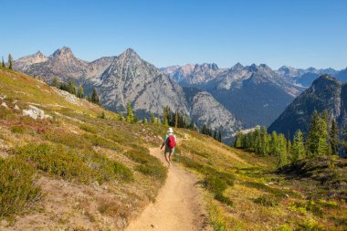 hiker in mountains on beautiful rock background
