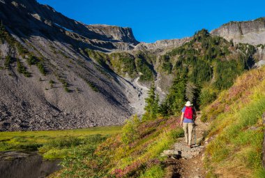 hiker in mountains on beautiful rock background