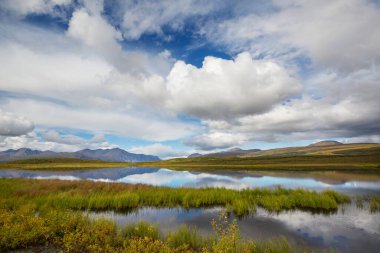 Beautiful blue lake in polar tundra along Dempster highway, Yukon, Canada