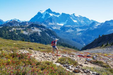 hiker in mountains on beautiful rock background