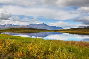 Beautiful blue lake in polar tundra along Dempster highway, Yukon, Canada