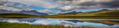 Beautiful blue lake in polar tundra along Dempster highway, Yukon, Canada