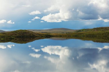 Beautiful blue lake in polar tundra along Dempster highway, Yukon, Canada