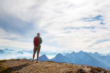 hiker in mountains on beautiful rock background