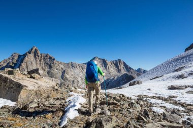 hiker in mountains on beautiful rock background