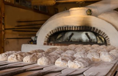 The hand made bread is prepared for oven baking