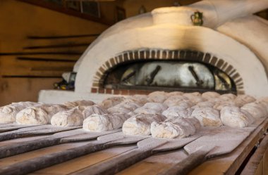 The hand made bread is prepared for oven baking