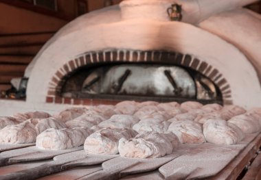The hand made bread is prepared for oven baking