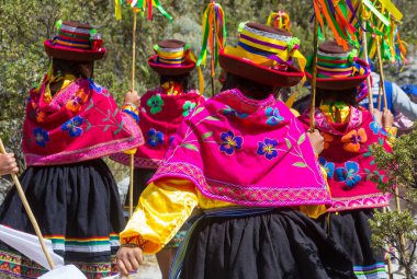 Girls in authentic costumas dancing during the traditional festival. Caraz region, Peru, South America clipart
