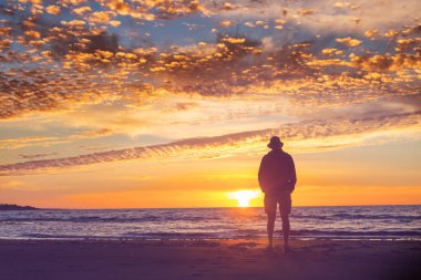 Man on ocean tropical beach. Vacation concept background.