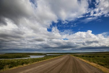 Endless Dempster Highway near the arctic circle, remote gravel road leading from Dawson City to Inuvik, Canada clipart