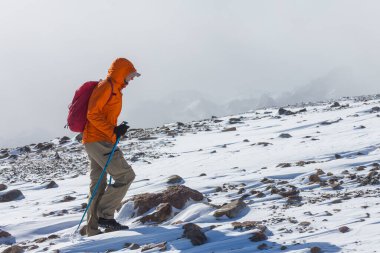 The climb in snowy mountains in the summer season