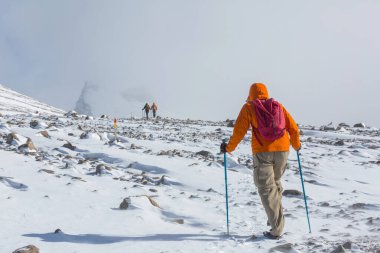 The climb in snowy mountains in the summer season