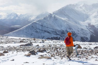 The climb in snowy mountains in the summer season