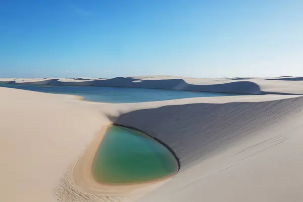 stock image Lagoons in the desert of Lencois Maranhenses National Park, Brazil. Unusual natural landscapes.