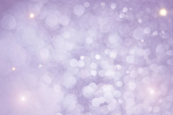 带有Bokeh的抽象紫色圣诞背景 图库照片