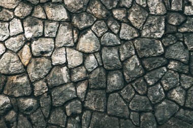 Old stone wall facade pattern as background. Detail from the town of Lovran in Croatia.